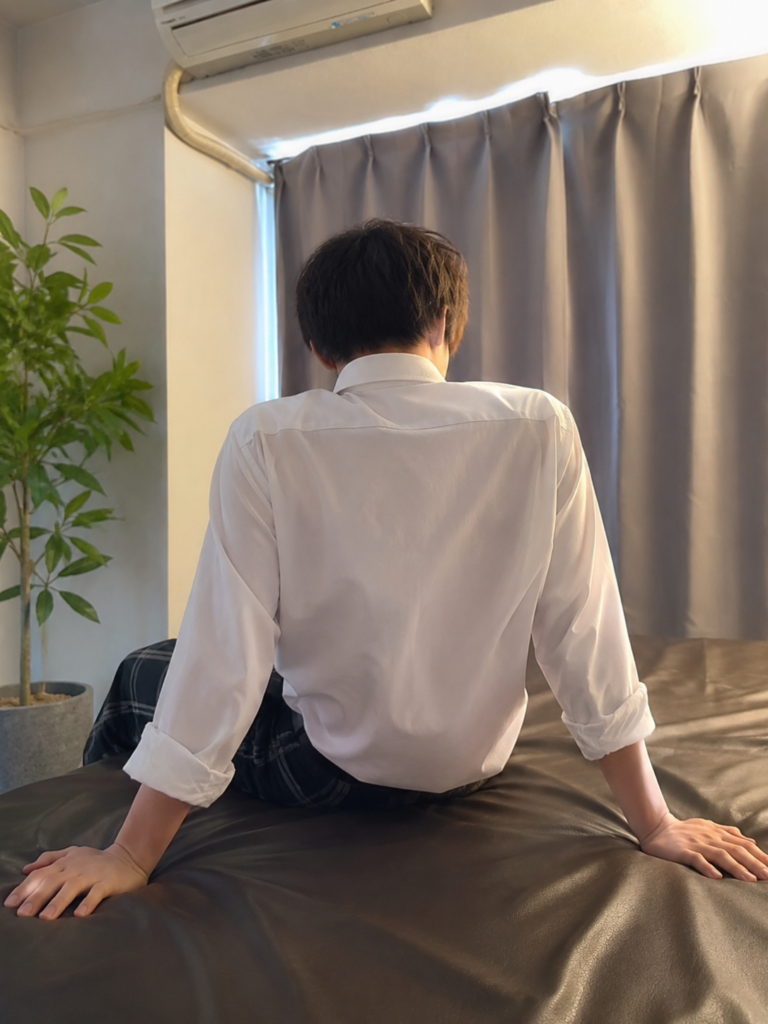 BackDoor大阪店で働く大学生セラピストA君の後ろ姿
